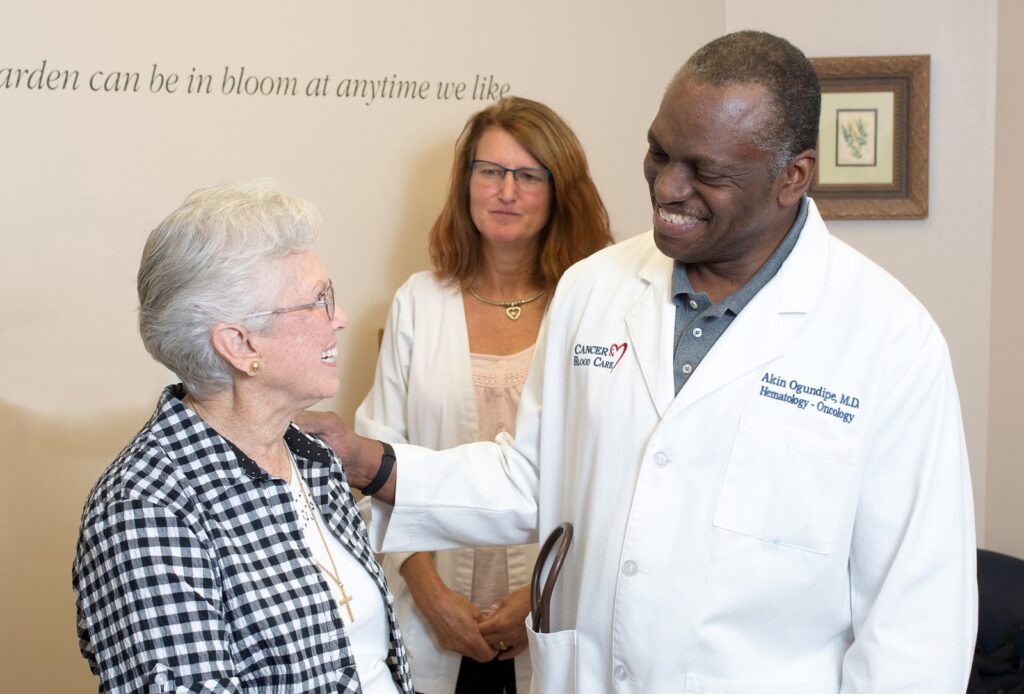 Dr. Akin Ogundipe with a patient at CRMC