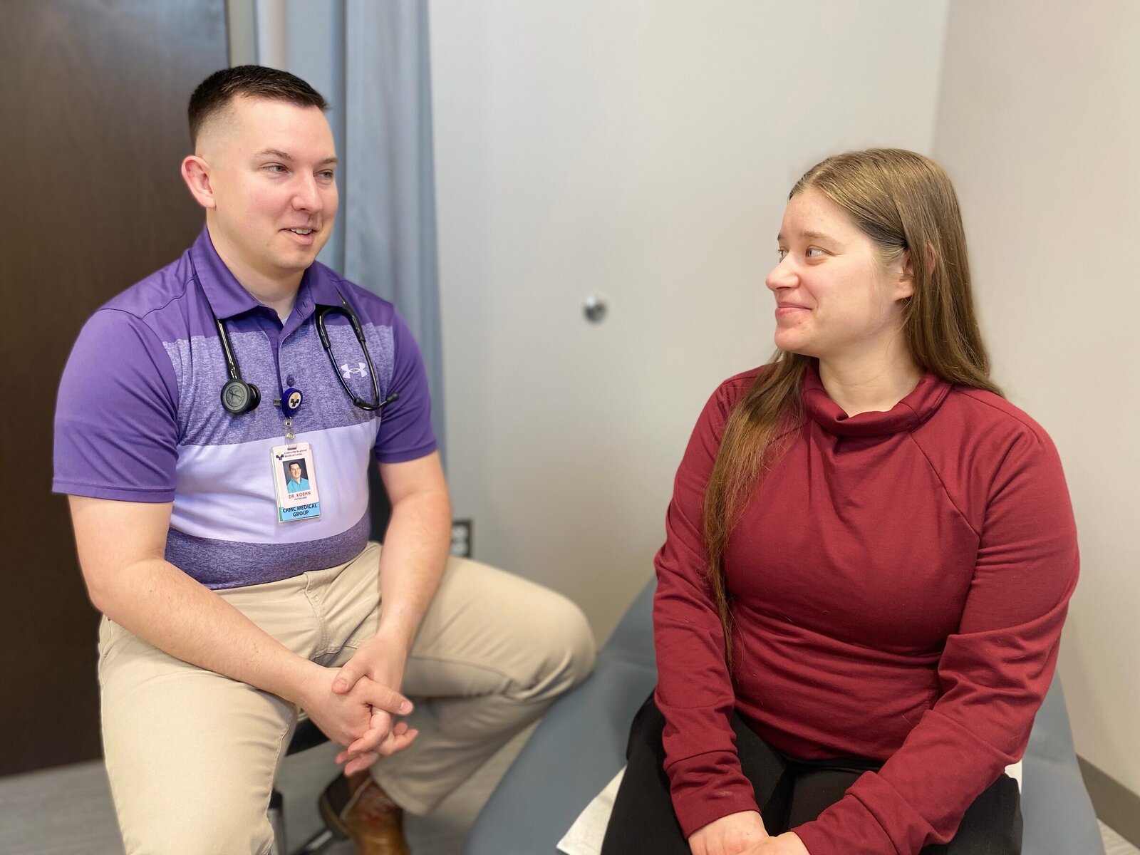 A CRMC women's health provider talks with a patient